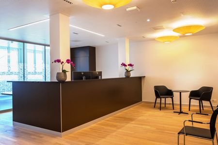 Waiting room of the day clinic with tables and chairs