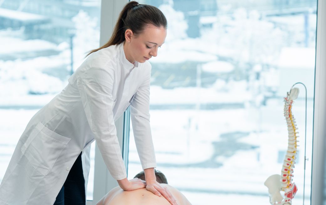 Chiropractor performs treatment on patient